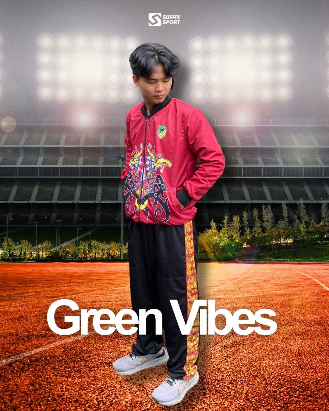 Seorang pria menggunakan jaket sport custom berwarna merah dengan motif etnik Dayak di latar belakang stadion